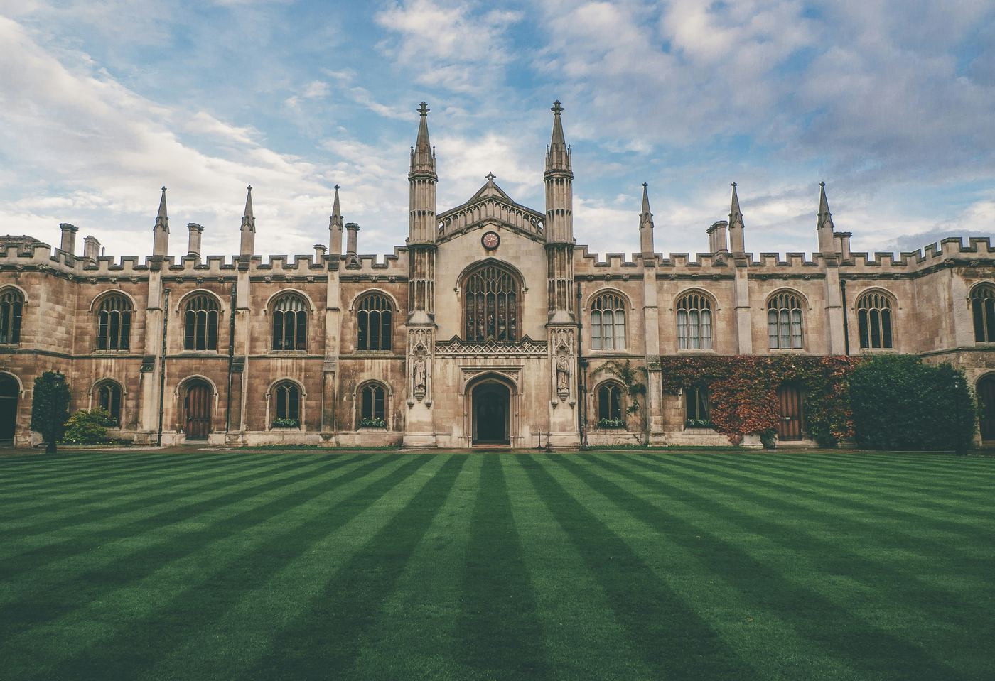 An Oxbridge college quadrangle with a striped lawn